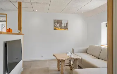 a living room with a couch and a table at Stunning Home In Vemb With Wifi in Vemb