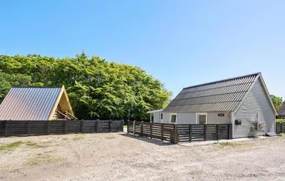 a barn and a house with a fence at Stunning Home In Vemb With Wifi in Vemb