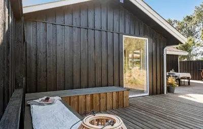 a wooden building with a bench on a deck at Stunning Home In Saltum With Wifi in Saltum