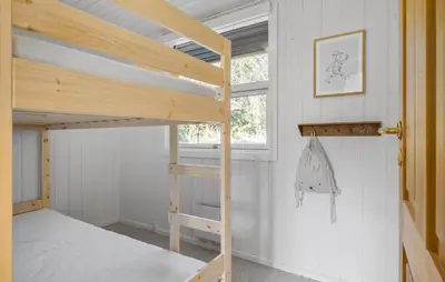 a bedroom with two bunk beds and a window at Stunning Home In Saltum With Wifi in Saltum