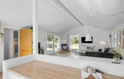 a white living room with a couch and a table at Stunning Home In Saltum With Wifi in Saltum