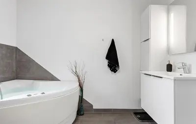 a white bathroom with a tub and a sink at 3 Bedroom Cozy Home In Højslev in Højslev