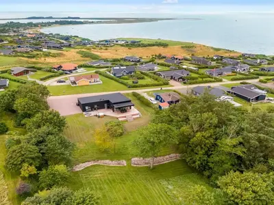 an aerial view of a village next to the water at Holiday Home Stjerne - 300m to the fjord by Interhome in Lemvig
