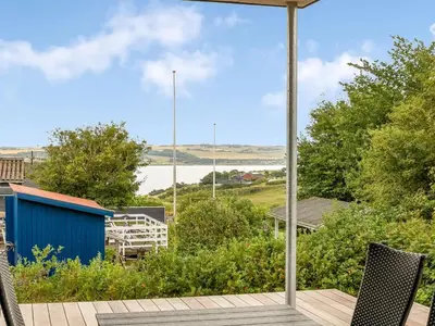 a view of the water from the deck of a house at Holiday Home Stjerne - 300m to the fjord by Interhome in Lemvig