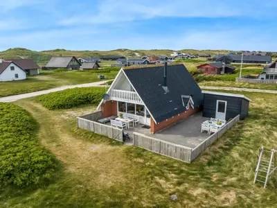 an overhead view of a house with a deck at Holiday Home Arkil - 200m from the sea by Interhome in Harboør