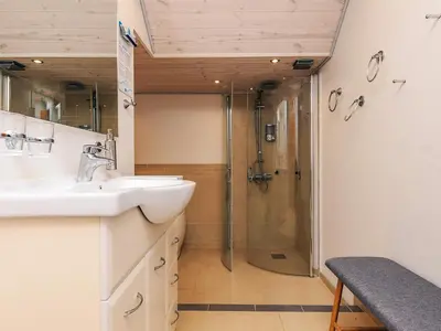a bathroom with a sink and a shower at 6 person holiday home in Vestervig in Vestervig
