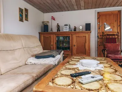 a living room with a couch and a coffee table at 6 person holiday home in Vestervig in Vestervig