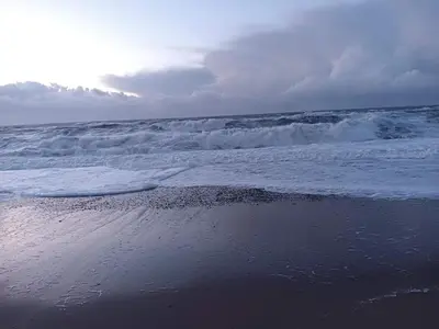 a beach with the ocean and the waves at 4 person holiday home in Vestervig in Vestervig