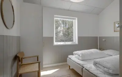 a bedroom with a bed and a window at Pet Friendly Home In Saltum With Sauna in Saltum