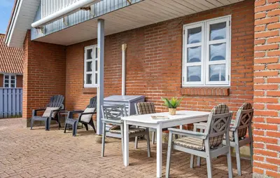 a patio with a table and chairs and a grill at Gorgeous Home In Vestervig With Wifi in Vestervig