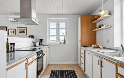 a kitchen with white cabinets and a sink and a window at Gorgeous Home In Vestervig With Wifi in Vestervig