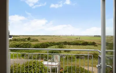 a view of a field from a window at 3 Bedroom Amazing Home In Harboøre in Harboør
