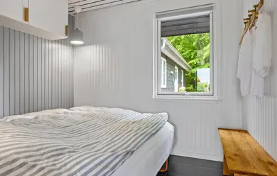 a bedroom with a bed and a window at 3 Bedroom Amazing Home In Fur in Fur