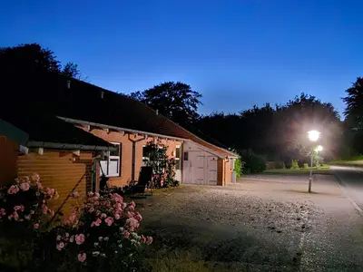 a building with a light on the side of it at Compact standard single room in Lemvig in Lemvig