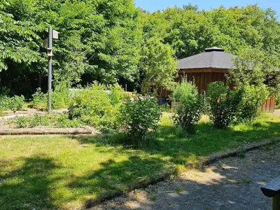 a garden with a gazebo and some bushes at Compact standard single room in Lemvig in Lemvig