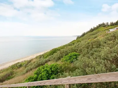 a view of the beach from the bluff at 4 person holiday home in Struer in Struer