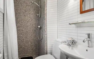 a bathroom with a shower and a toilet and a sink at Amazing Home In Roslev With Wifi in Roslev