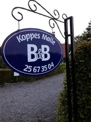 a blue sign that reads kopes mobile bdb at Koppes Mølle B&B - naturnær overnatning in Borup