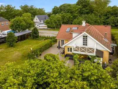 an aerial view of a house with a yard at Holiday Home Elza - 2-5km from the sea by Interhome in Fjerritslev