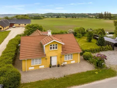 an overhead view of a yellow house with a roof at Holiday Home Elza - 2-5km from the sea by Interhome in Fjerritslev