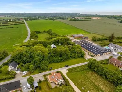 an aerial view of a house and a road at Holiday Home Elza - 2-5km from the sea by Interhome in Fjerritslev