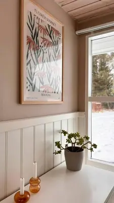 a table with two candles and a potted plant at Beautiful Home Near Løkken On Secluded Plot in Løkken