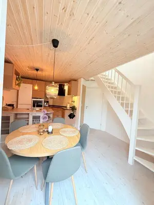 a kitchen and dining room with a table and chairs at Cozy Pearl in Viborg Centre in Viborg