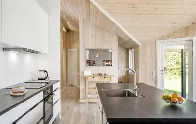 a kitchen with a sink and a bowl of fruit on a counter at 4 Bedroom Stunning Home In Fjerritslev in Fjerritslev