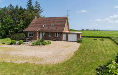 a small house in the middle of a field at Stunning Home In Nykøbing M With Sauna in Alsted