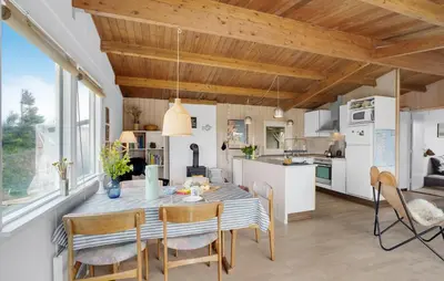 a kitchen and dining room with a table and chairs at Pet Friendly Home In Thisted With Wifi in Thisted