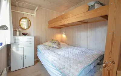 a bedroom with a bunk bed with a wooden ceiling at 2 Bedroom Pet Friendly Home In Thisted in Thisted