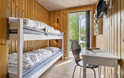 a bedroom with a desk and a bunk bed and a deskablish at Awesome Home In Løgstør With Wifi in Løgstør