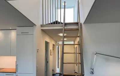 a staircase leading to the second floor of a house at Cozy Home In Vestervig With Sauna in Vestervig