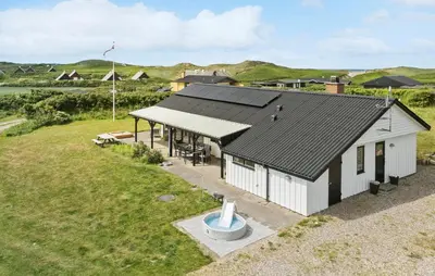 an overhead view of a white house with a black roof at Gorgeous Home In Lemvig in Lemvig