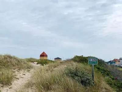 a speed limit sign on the side of a beach at 4 star holiday home in Thyborøn in Thyborøn