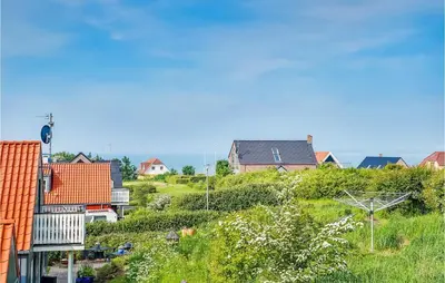 a small town with houses on a hill at Holiday Home Spøttrup - 04 in Spottrup