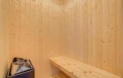 a corner of a sauna with a trash can at Holiday Home Spøttrup - 04 in Spottrup