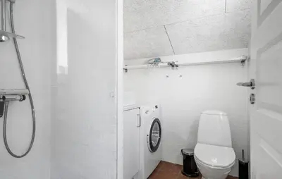a white bathroom with a toilet and a sink at Amazing Home In Thisted With Sauna in Thisted