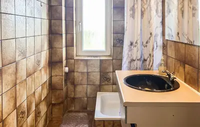 a bathroom with a sink and a window at Amazing Home In Harboøre With Wifi in Harboør