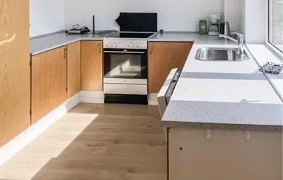 a kitchen with a sink and a stove at Amazing Home In Harboøre With Wifi in Harboør