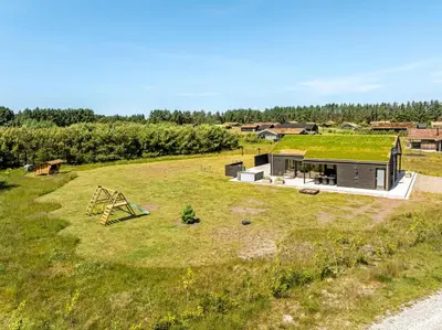 an aerial view of a house with a green roof at Laustvej 3 in Saltum