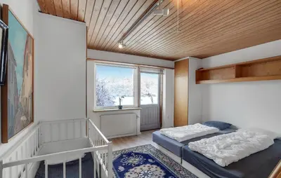 a room with two beds and a window at 2 Bedroom Pet Friendly Home In Thisted in Thisted