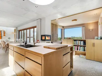 a kitchen with a large island with a sink at Holiday Home Rieke - 250m from the sea by Interhome in Torsted