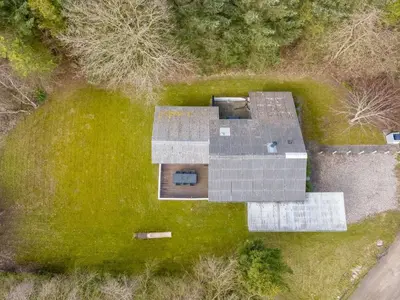 an overhead view of a house in a green field at Holiday Home Iris - 200m to the fjord by Interhome in Thyholm