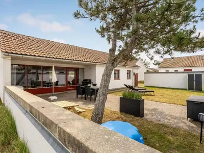 a home with a tree in the backyard at Holiday Home Aike - 1km from the sea by Interhome in Pandrup