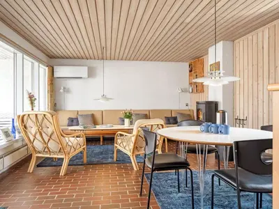 a dining room with a table and chairs at Holiday Home Aike - 1km from the sea by Interhome in Pandrup
