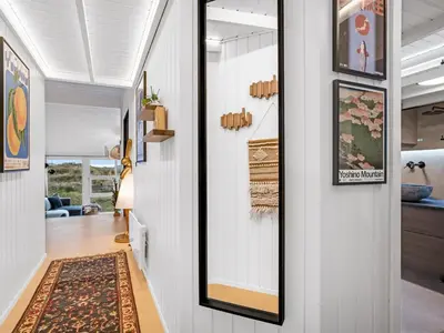 a hallway with a mirror in a house at Holiday Home Marcus - 500m from the sea by Interhome in Saltum