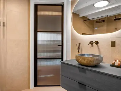 a bathroom with a bowl sink and a mirror at Holiday Home Marcus - 500m from the sea by Interhome in Saltum
