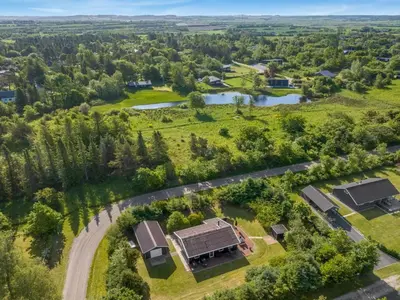 an aerial view of a farm with a house at Holiday Home Laris - 700m to the fjord by Interhome in Løgsted