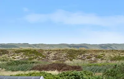 a view of a field with mountains in the background at Pet Friendly Home In Vestervig With Wifi in Vestervig